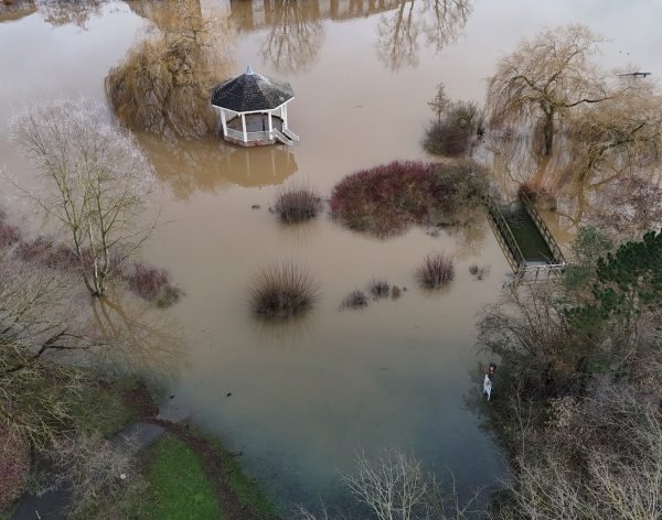an aerial view of flood and flooded area with pavilion surrounded by water