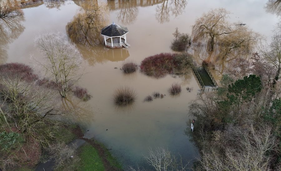 an aerial view of flood and flooded area with pavilion surrounded by water